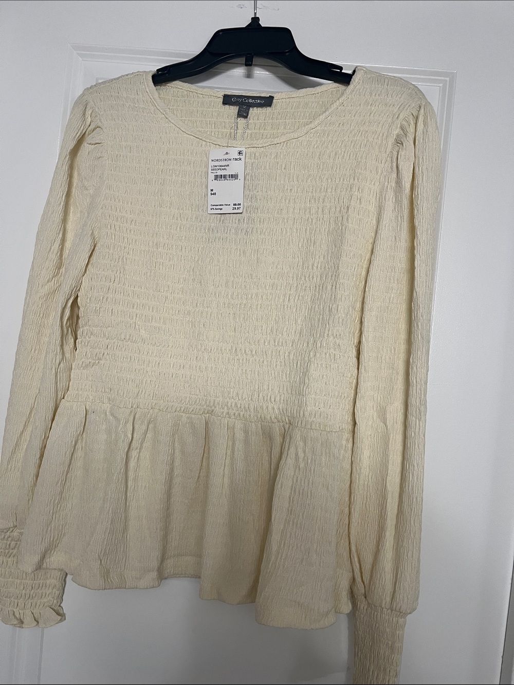 Cream Textured Peplum Blouse — Long Sleeve